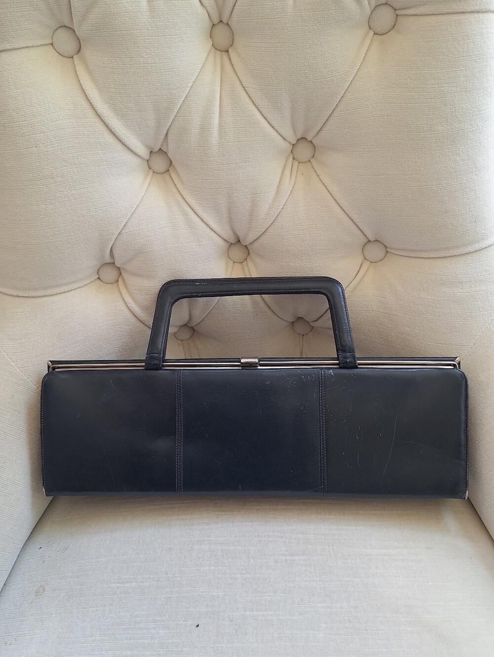 Vintage Waldman Navyk eather purse with gold lock closure.